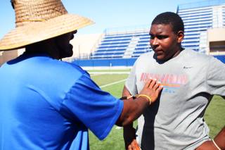 Bishop Gorman High School lineman, and UNLV recruit, Ron Scoggins, gets instructions from his coach during practice Tuesday, July 12, 2011.